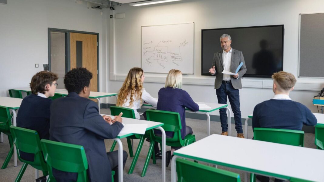 Schools in England get extra £500m in bid to avoid teachers’ pay strike A teacher addressing pupils in a school classroom