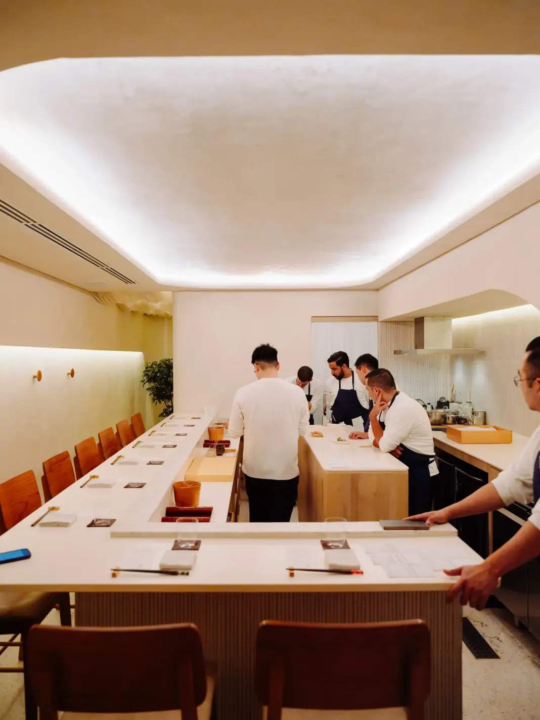 The Distinctly Brazilian Flavor of São Paolo’s Japanese Cuisine Image may contain Indoors Chair Furniture Adult Person Plywood Wood Table Architecture Building and Dining Room