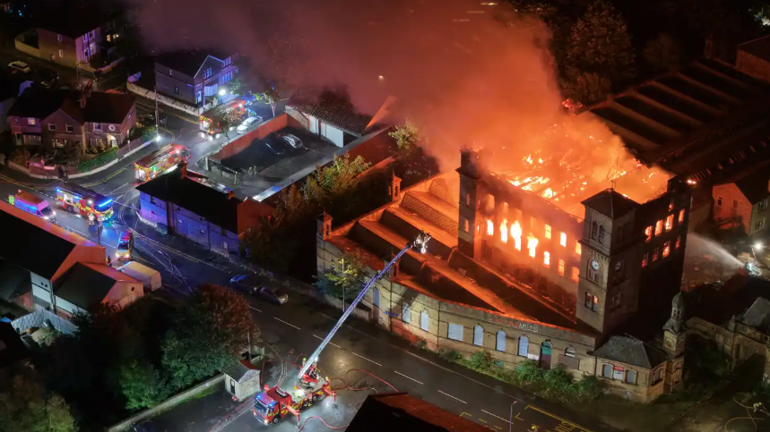 An old mill on fire