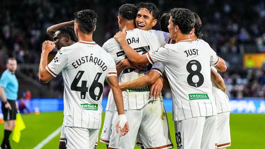 Swansea City players celebrate