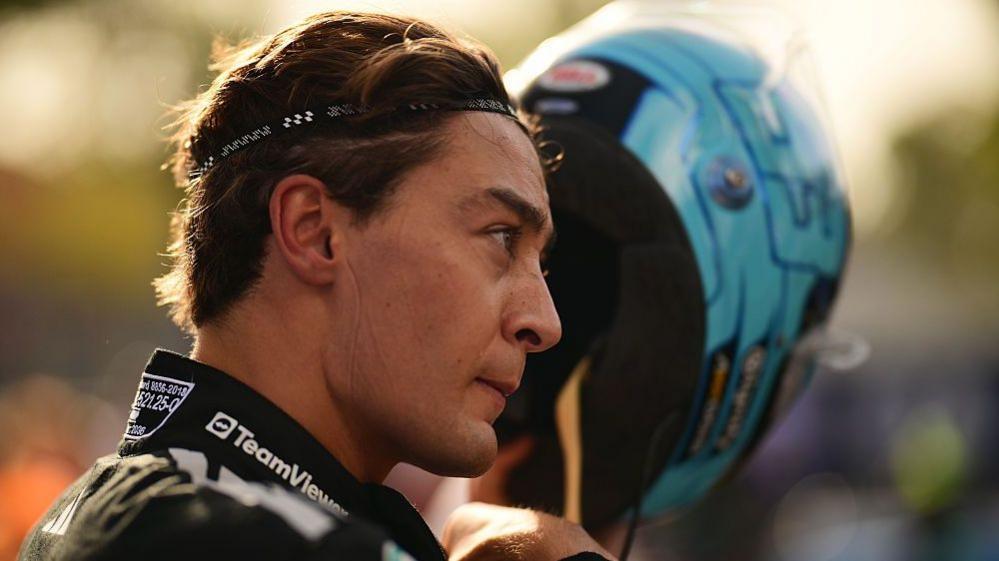 George Russell takes his helmet off after qualifying for the Italian Grand Prix