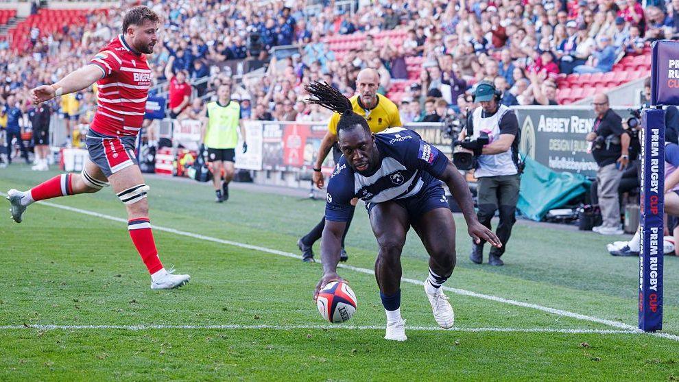 Bristol Bears' Gabriel Ibitoye scores his sides third try during the PREM Rugby Cup match between Bristol Bears and Gloucester Rugby at Ashton Gate.