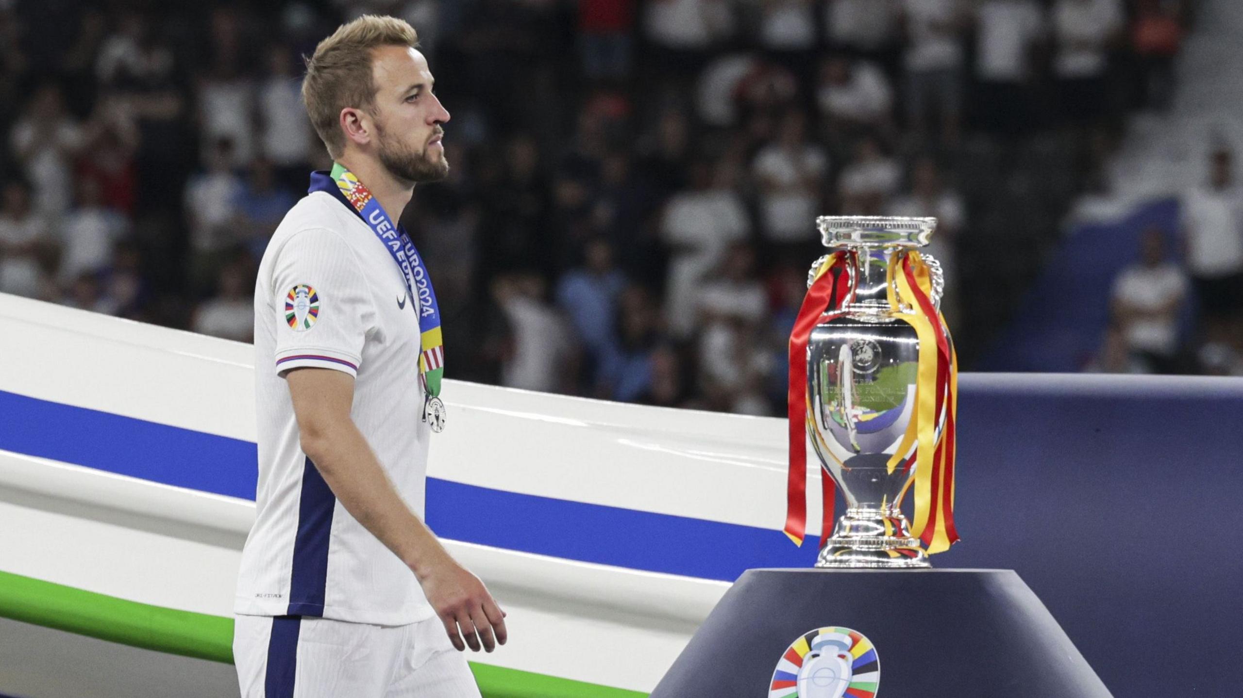 Harry Kane walks past Euro 2024 trophy after England lose final to Spain