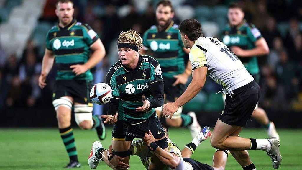 Henry Pollock being tackled while playing for Northampton