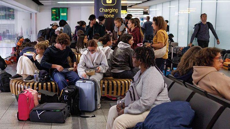Passengers wait for flights and connections at the South terminal of Gatwick Airport on September 09, 2026.