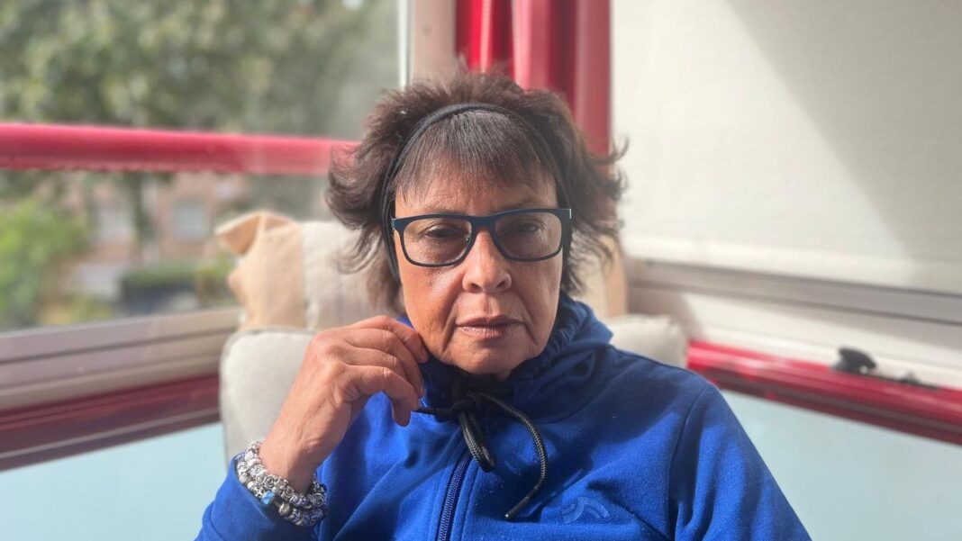 British widow faces deportation from Sweden after 22 years Joyce Thomas wears a blue jumper in a photo taken inside her home in Sweden.