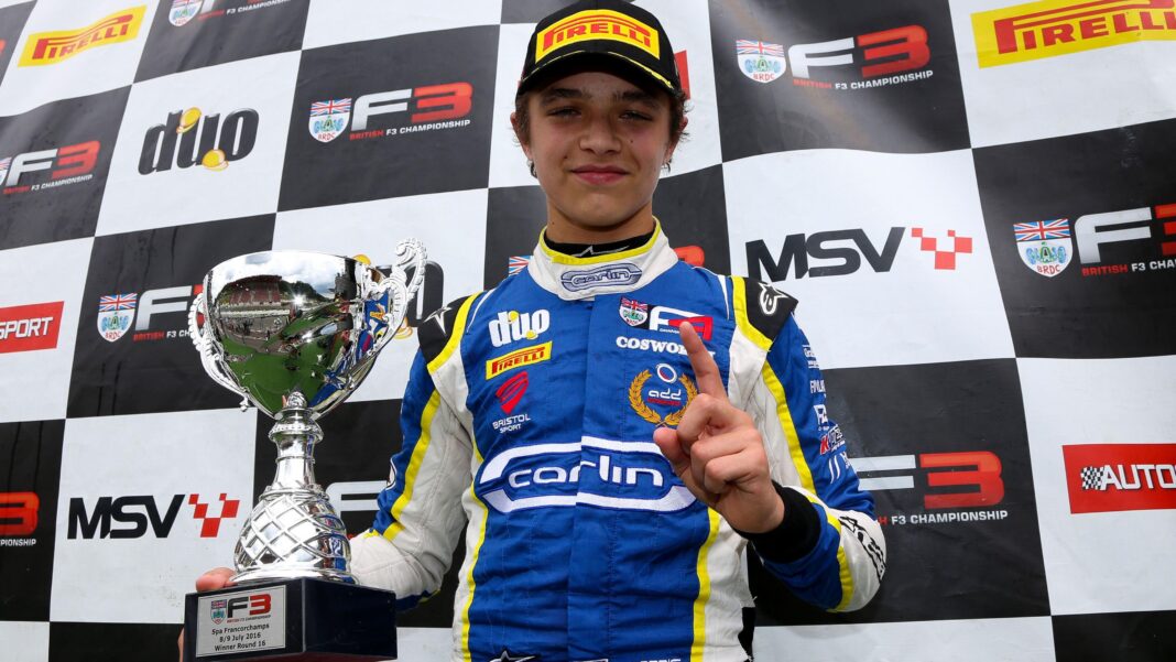 Lando Norris holding a trophy after a victory in the British F3 championship at Spa-Francorchamps in 2016