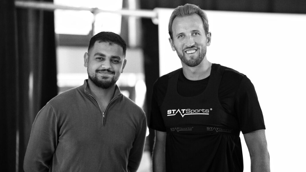 Umir Irfan (left) and Harry Kane (right) stand for a photo following an interview in Munich