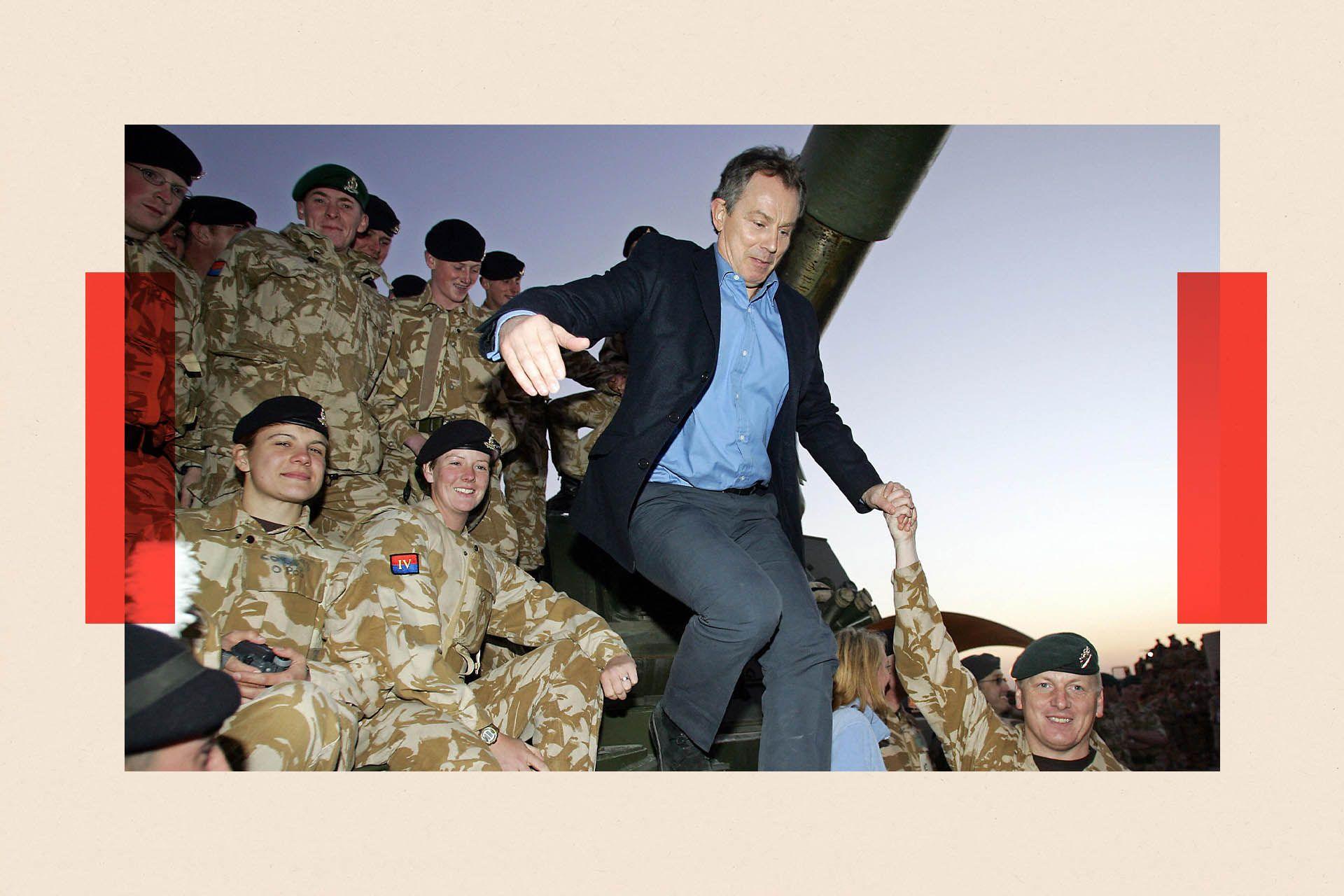 Britain's Prime Minister Tony Blair (C) jumps from a tank after meeting troops at a British Army base near Basra in Iraq, 21 December 2004