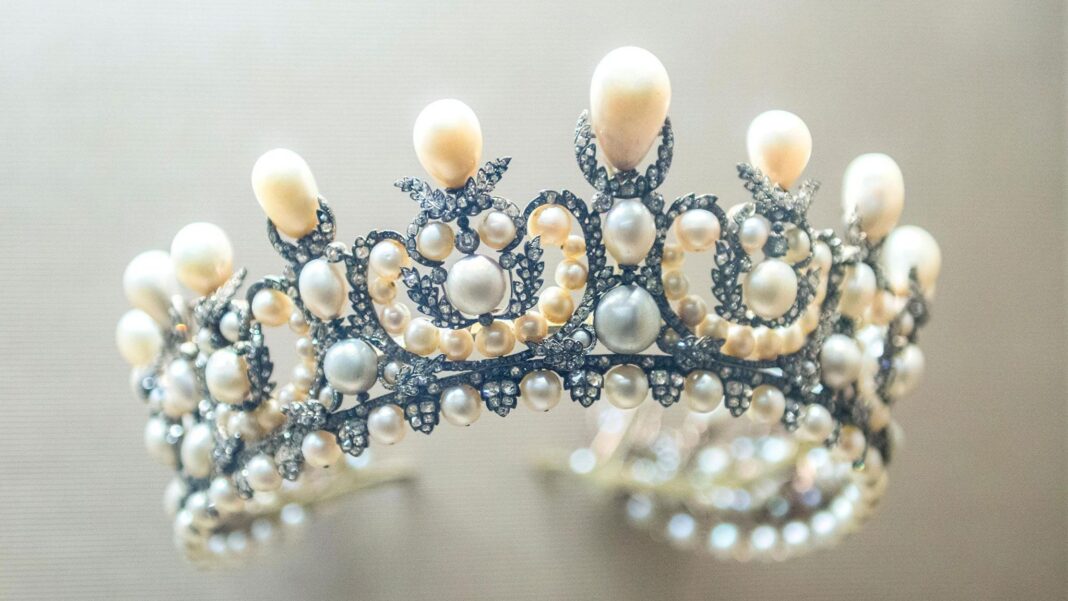 Four Renoir paintings worth millions stolen in French museum heist Close up photo of ornate pearl and diamond tiara worn by Empress Eugenie as displayed at the Louvre Museum, Paris