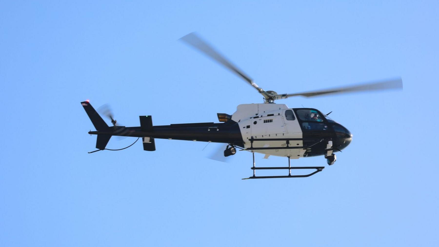 A file photo of a black and white helicopter