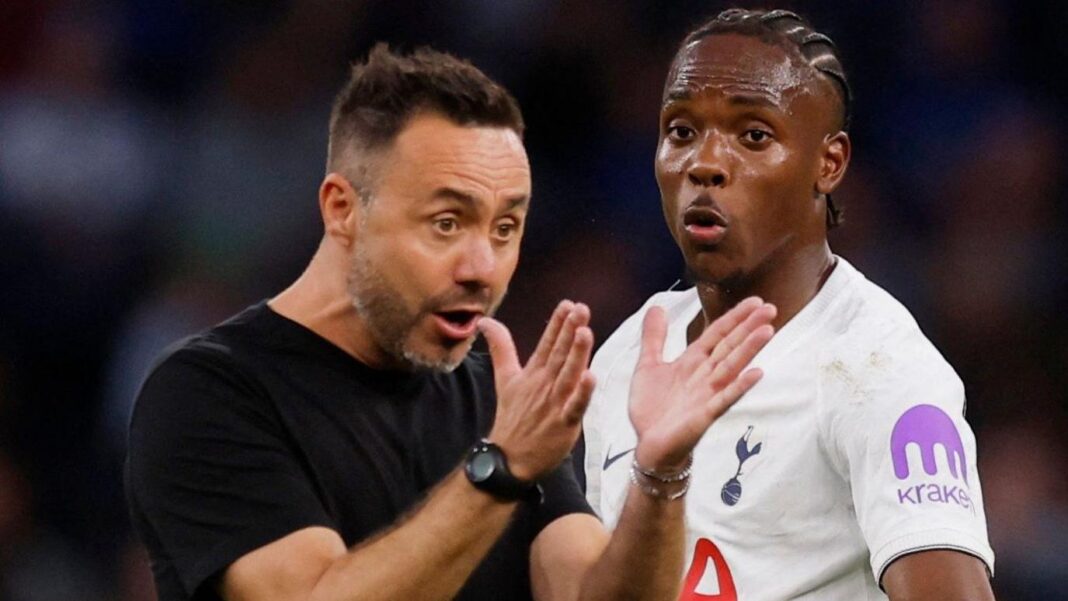 Why this break has come at the worst time for De Zerbi & Spurs Spurs boss Roberto de Zerbi holds both hands out in front of him and stares towards them as he makes a point while standing alongside forward Mathys Tel
