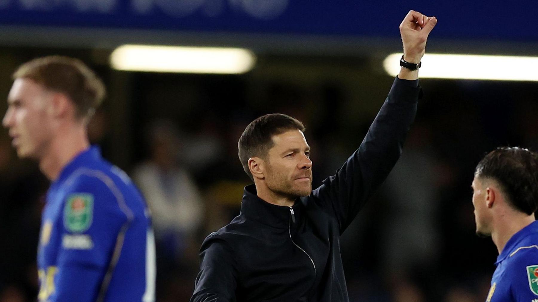 Xabi Alonso celebrates after Chelsea's win over Leeds United, raising his left arm in a satisfied salute