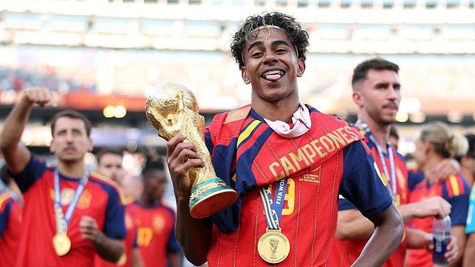 Spain midfielder Lamine Yamal with the World Cup trophy