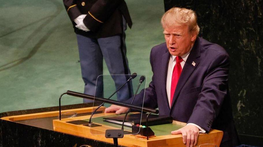 President Trump at the lectern inside the UNGA hall