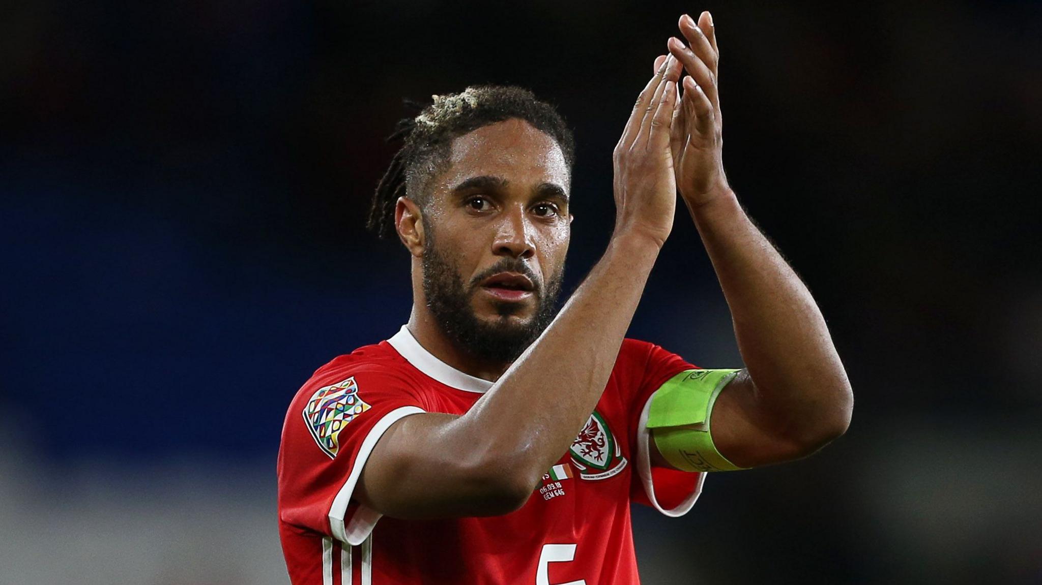 Ashley Williams applauds the Wales supporters