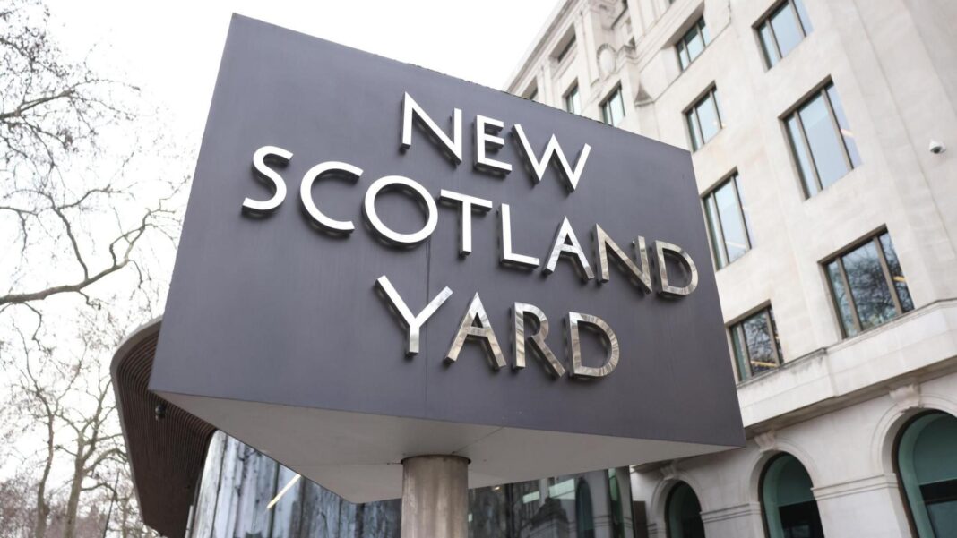 Two arrested in London on suspicion of assisting Iran’s intelligence service A triangular New Scotland Yard sign outside the Metropolitan Police offices in London.