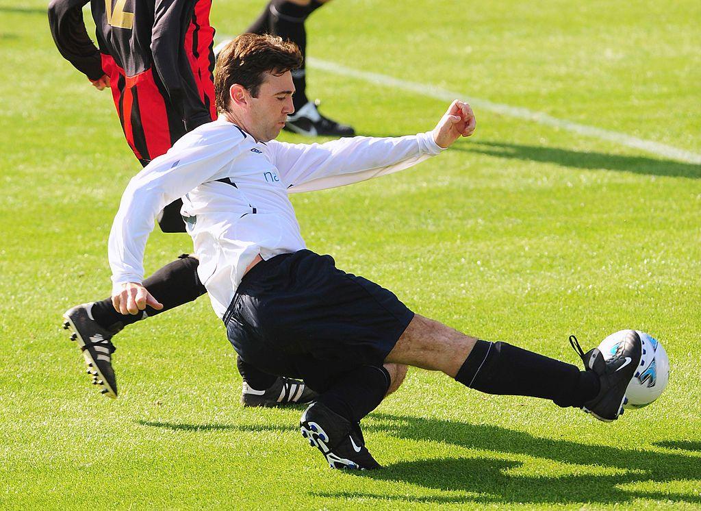 Andy Burnham shoots at goal during the annual Labour MPs vs lobby journalists football match in Brighton in 2009.