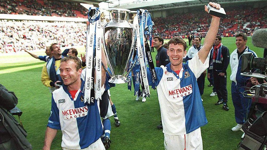 Alan Shearer and Chris Sutton lift the Premier League trophy