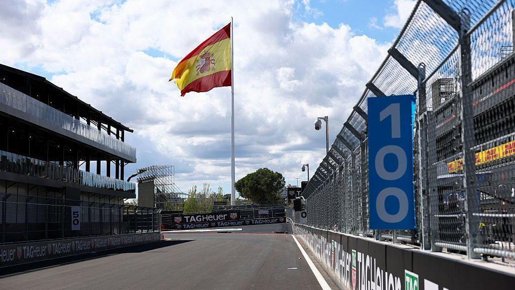 Madring start-finish straight with a huge Spanish flag standing at the end of it