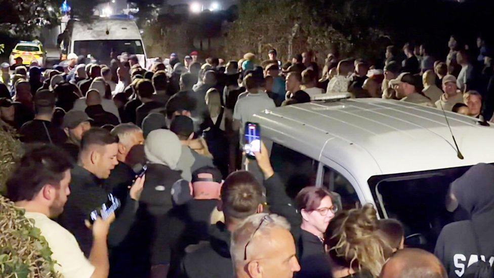 Crowds surround police vans in Portsmouth