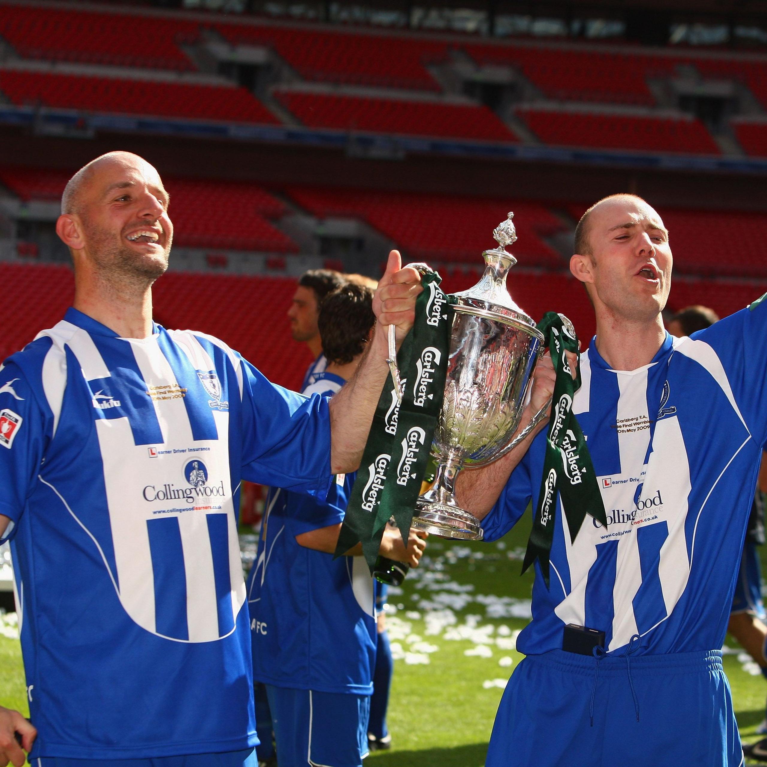 Whitley Bay strikers Paul Chow (left) and Lee Kerr celebrate with the FA Vase trophy