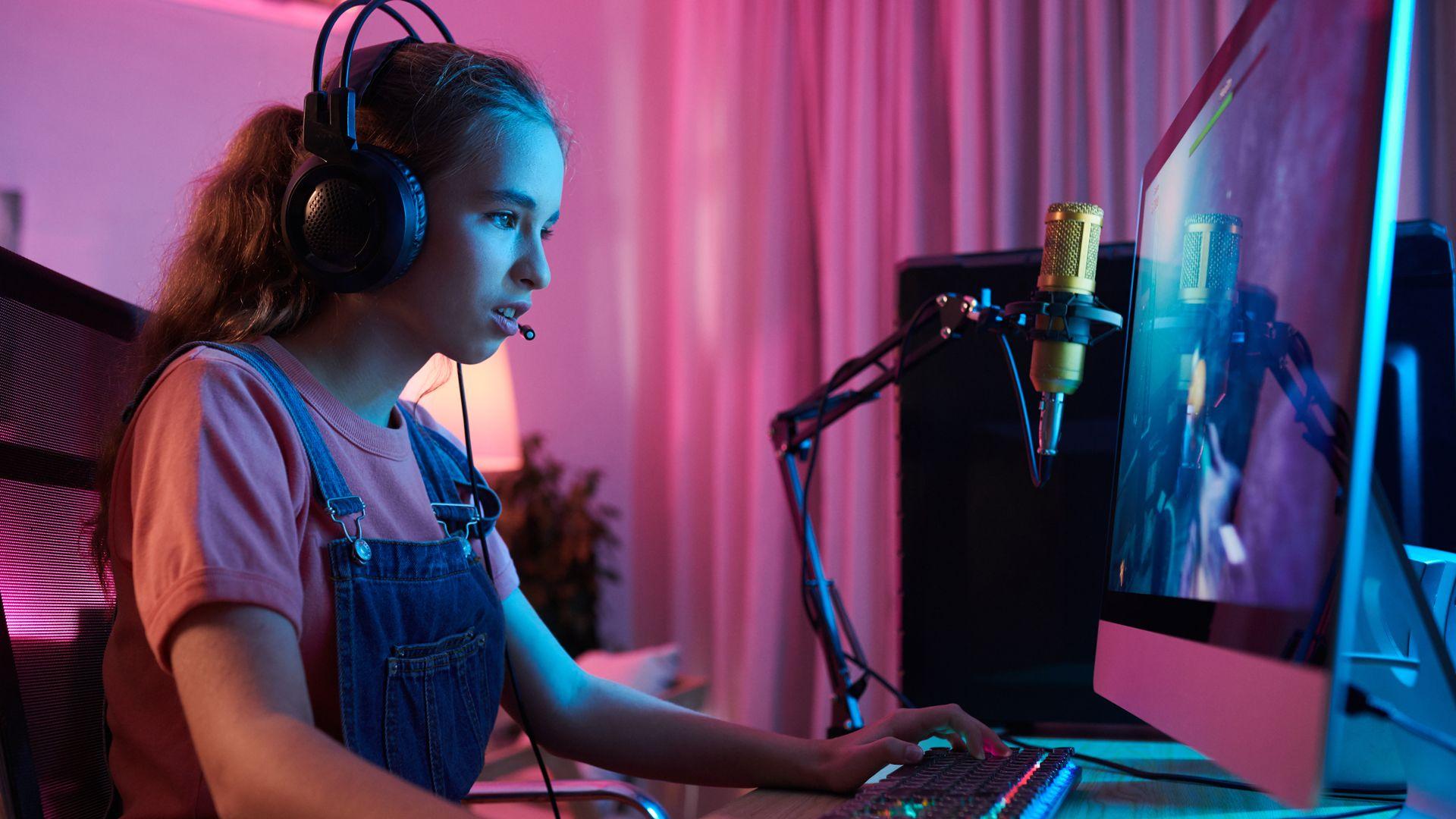 Concentrated teenage girl gaming