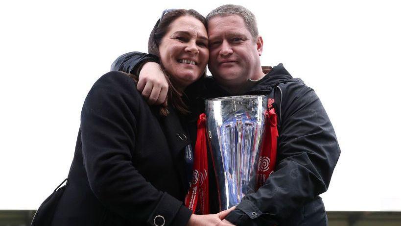 Debbie Beard pictured with her late husband Matt, former Liverpool Women manager after the club sealed promotion to the Barclays FA Women's Super League in 2022