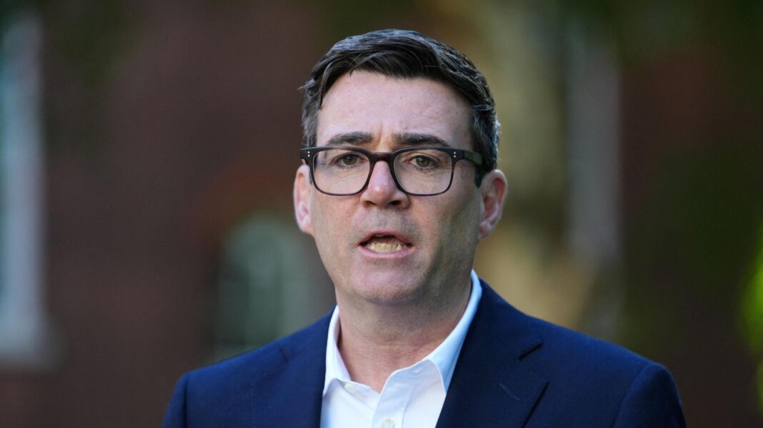 PM to warn EU chief of ‘damage’ posed by Made in Europe scheme Andy Burnham wearing a navy suit and a white shirt.