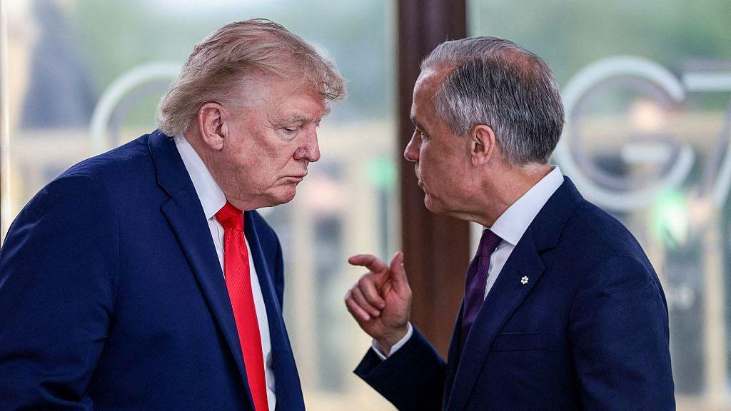US President Donald Trump speaks to Canadian Prime Minister Mark Carney