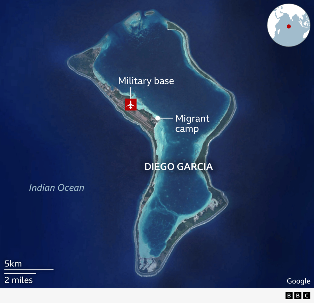 A graphic showing the location of the military base and migrant camp on an aerial image of Diego Garcia.