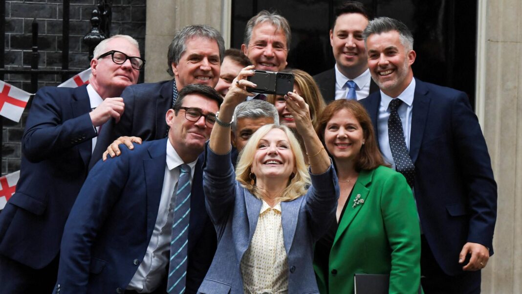 MP calls for Yorkshire to get its own parliament Image shows a group of 11 Mayor's outside number 10 Downing Street taking a selfie. Former Mayor of Greater Manchester Andy Burnham is to the left of shot wearing a blue suit and striped tie. The Mayor of West Yorkshire Tracy Brabin is in centre shot, wearing a blue suit and is holding a phone high to take the selfie of all of the mayors.