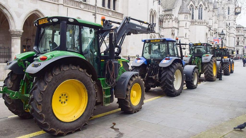 Tractors seen lined up outside the Royal Courts of Justice.