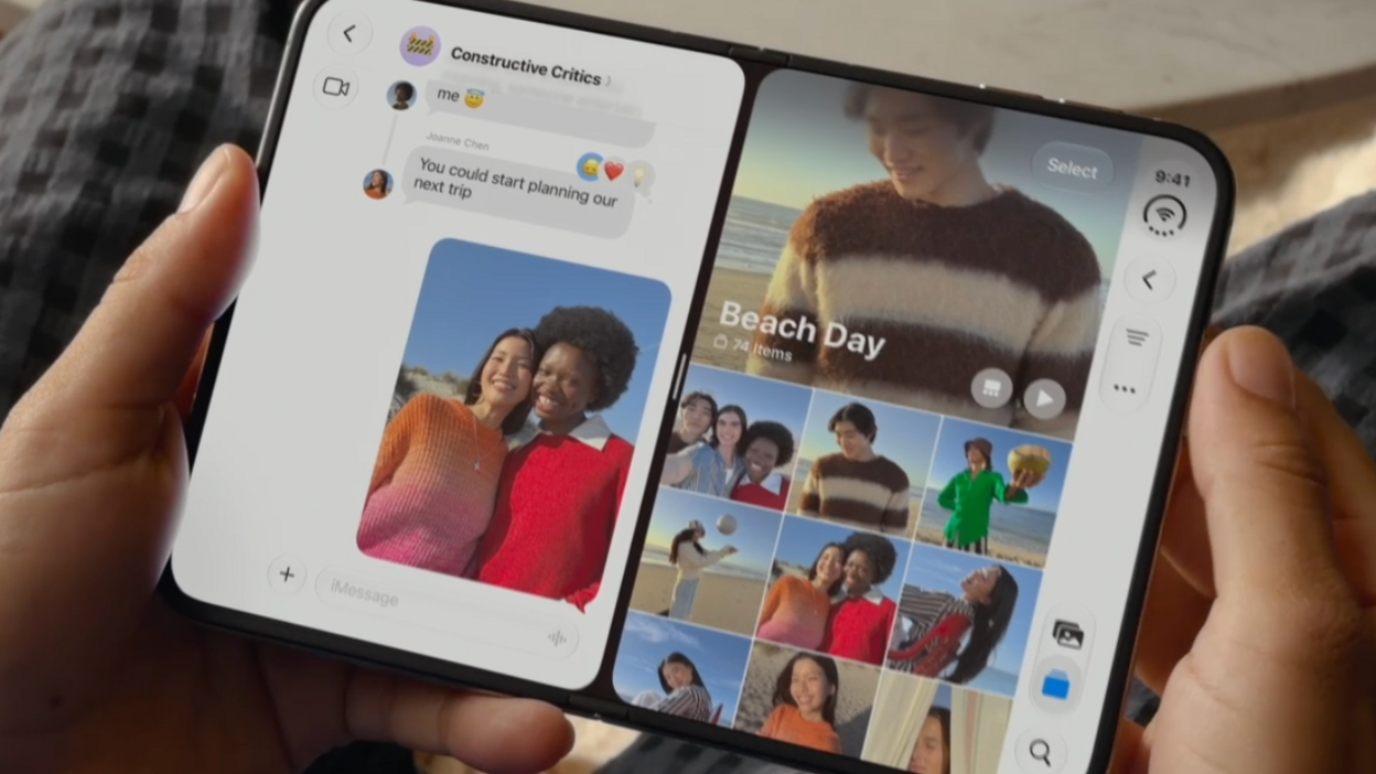 Hands holding the folding iPhone like a book, with messages on one side and images on the other.