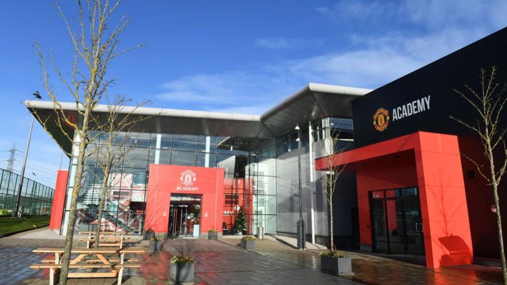 An exterior view of the Manchester United youth football training academy at the Carrington training complex