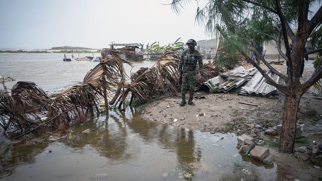 A member of the Mexican Navy stands near a flooded area in Puerto San Carlos, Baja California Sur state, Mexico, on September 28, 2026, ahead of the arrival of Hurricane Polo