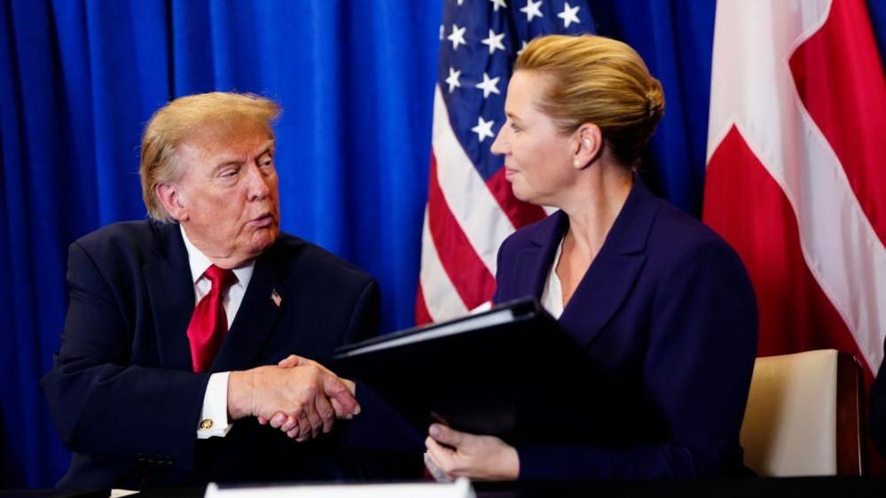 US President Donald Trump and Denmark's Prime Minister Mette Frederiksen shake hands during the signing ceremony for a trilateral Arctic security agreement between the United States, Denmark, and Greenland at the UN Headquarters in New York on 22 September 2026