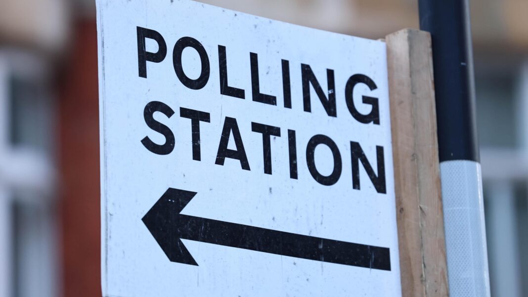 Greens aim for first London MP in Holborn race A polling station sign on a post. Polling station is written in black on white background, with an arrow pointing to the left below the words