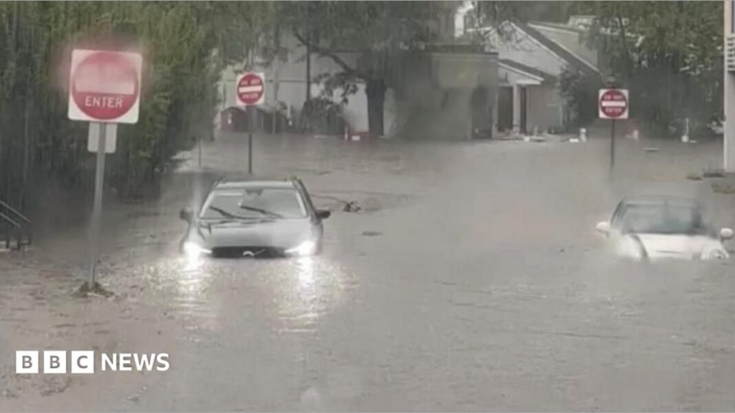 Flash flooding interrupts half-marathon, submerges cars image