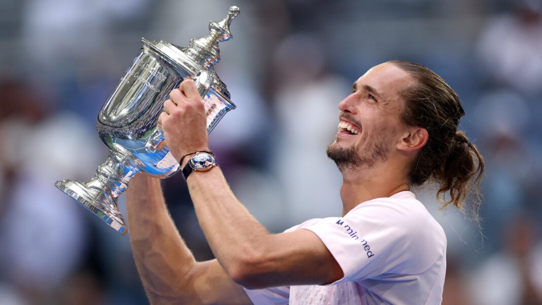 Alexander Zverev celebrates with the US Open trophy