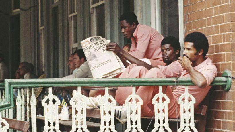 West Indies players sit on a balcony during World Series Cricket