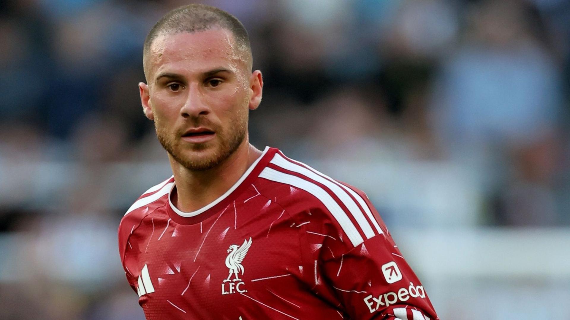 Liverpool midfielder Alexis Mac Allister, wearing the club's red home kit, looks on during a Premier League game