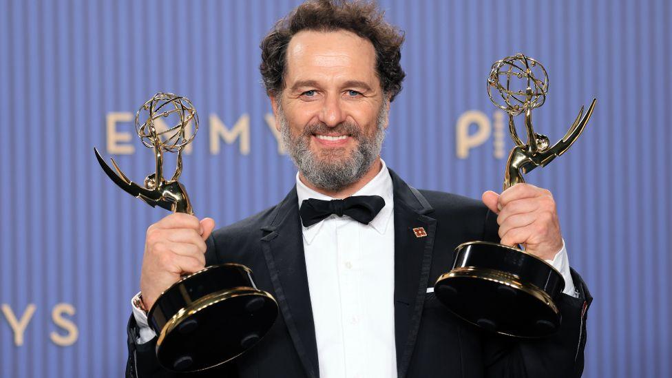 Matthew Rhys, winner of the Outstanding Lead Actor in a Comedy Series Award for "Widow's Bay" and the Outstanding Lead Actor in a Limited or Anthology Series or Movie Award for "The Beast in Me" poses in the press room during the 78th Primetime Emmy Awards at Peacock Theater on September 14, 2026 in Los Angeles, California