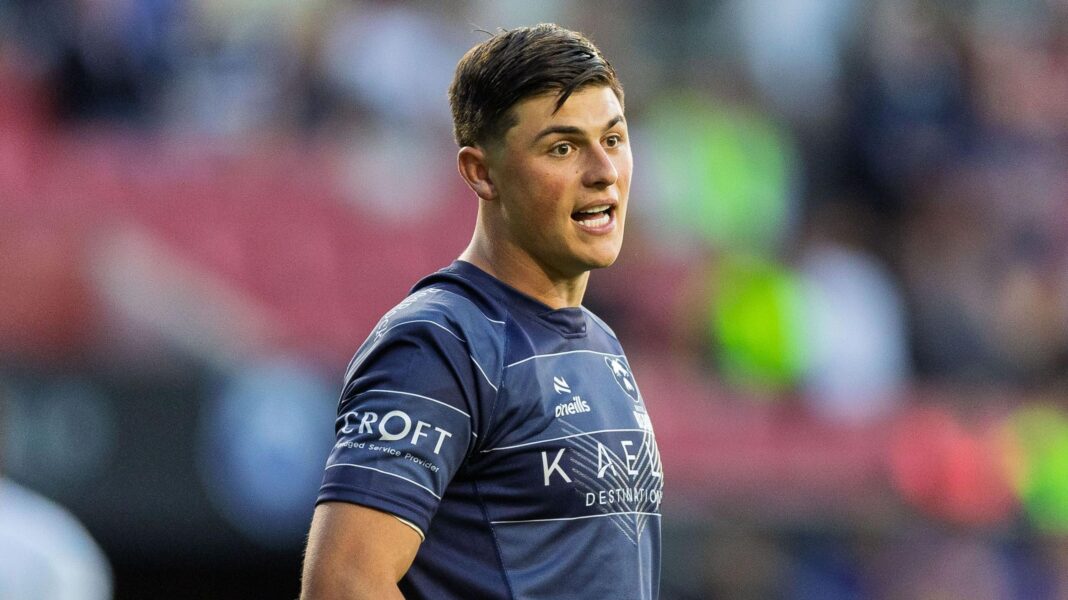 Rees-Zammit to return to wing for new season Louis Rees-Zammit stands on the pitch talking during a match for Bristol last season