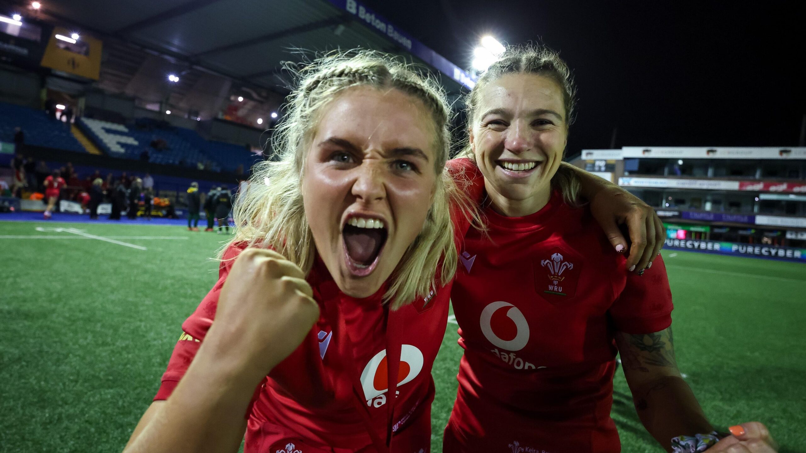 Wales co-captain Alex Callender celebrates victory with Keira Bevan