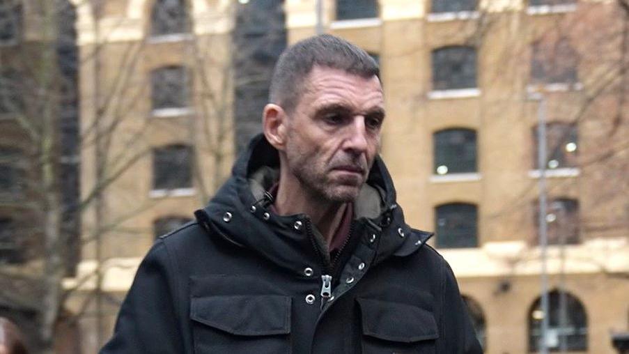 Tim Westwood arrives at court wearing a black coat