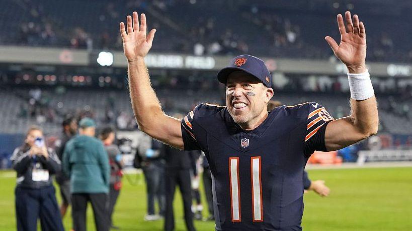 The Chicago Bears' Case Keenum with his arms in the air