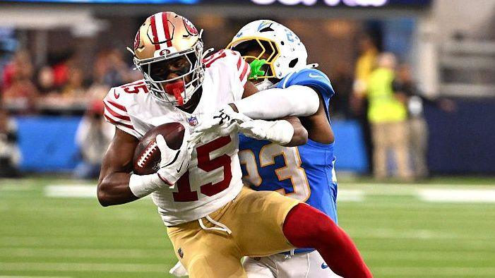 De'Zhaun Stribling of the San Francisco 49ers is tackled by Tony Jefferson of the Los Angeles Chargers during an NFL pre-season game in August 2026
