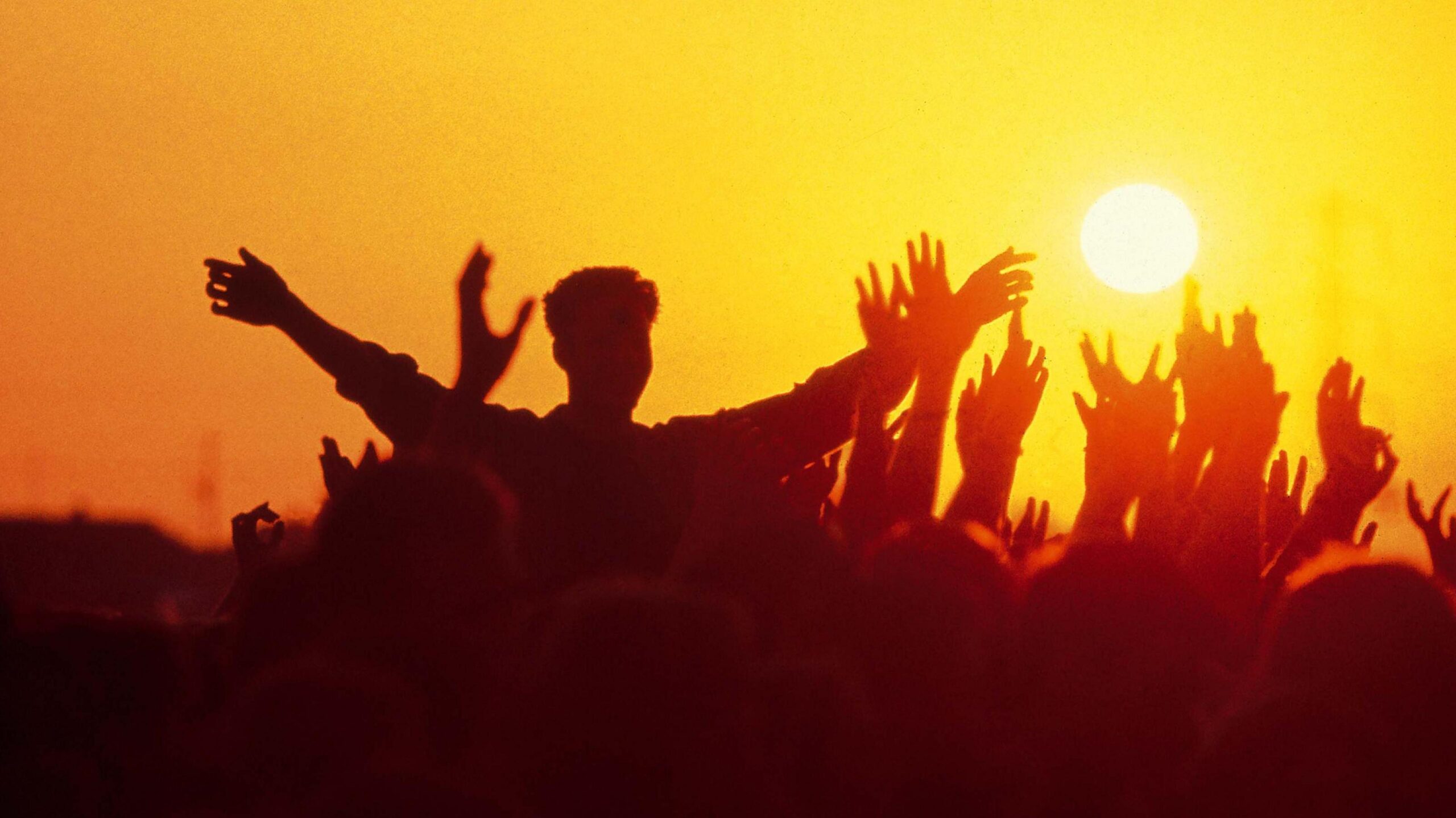 Glastonbury crowd at sunset