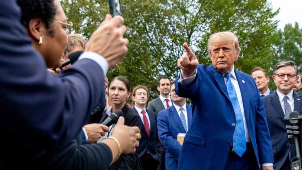 US President Donald J. Trump (2-R), with Speaker of the House Mike Johnson (R), responds to a question from the news media outside the West Wing of the White House in Washington, DC, USA, 29 September 2026.